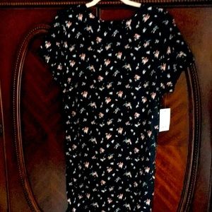 Long black dress with spring flowers short sleeves just below the knees.